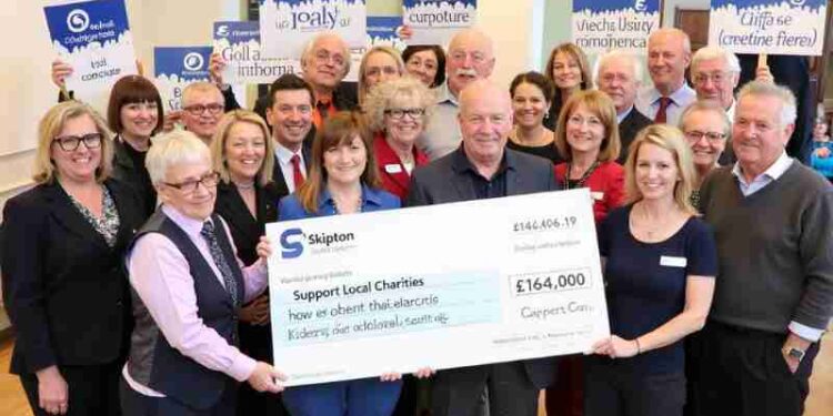 Skipton Launches Community Giving Scheme: £164,000 Available for Local Charities, Concept art for illustrative purpose, tags: building scheme - Monok